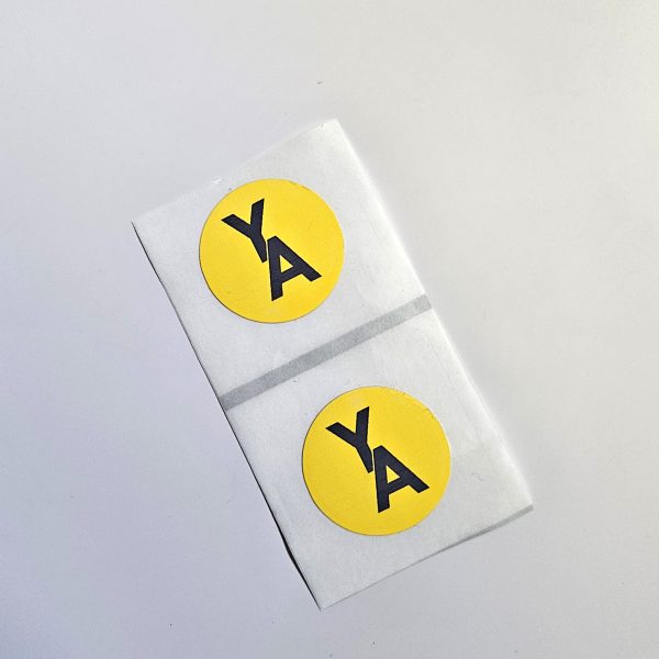 "YA" printed on 25mm diameter NFC sticker